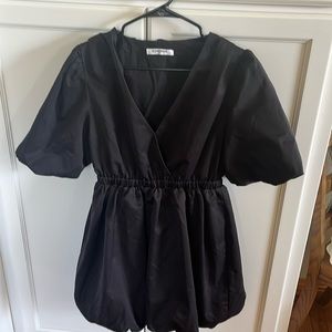 Black mini dress with bubble sleeves and bubble skirt.